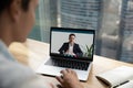 Male colleagues talk on video call on laptop online Royalty Free Stock Photo
