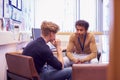 Male College Student Meeting With Campus Counselor Discussing Mental Health Issues Royalty Free Stock Photo