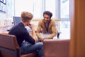 Male College Student Meeting With Campus Counselor Discussing Mental Health Issues Royalty Free Stock Photo