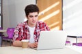 Male College Student Using Laptop In Classroom Royalty Free Stock Photo