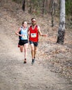 Male competitors running down the bush trail in the Australian Mountain Running Championships