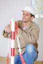 male construction worker erecting safety barrier