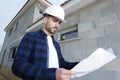 male construction worker holding construction plan Royalty Free Stock Photo