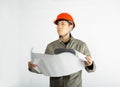 Male construction worker and sketching blueprints Royalty Free Stock Photo