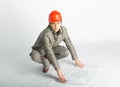 Male construction worker and sketching blueprints Royalty Free Stock Photo