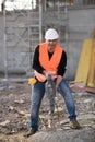 Male construction worker using jackhammer Royalty Free Stock Photo
