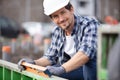 male construction worker using spirit level on site Royalty Free Stock Photo