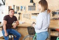 Male is consultating female about bicycle Royalty Free Stock Photo