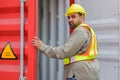 Foreman or technician worker opening container door to inspect empty container condition at cargo shipping warehouse yard Royalty Free Stock Photo