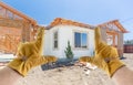 Male Contractor Hands Framing Completed Section of House Being Built Royalty Free Stock Photo