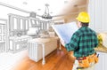 Male Contractor with Hard Hat and Plans Looking At Custom Kitchen Royalty Free Stock Photo