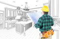 Male Contractor with Hard Hat and Plans in A Custom Kitchen Royalty Free Stock Photo