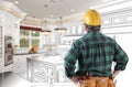 Male Contractor with Hard Hat and Tool Belt Looking At Custom Kitchen Drawing Photo Combination On White. Royalty Free Stock Photo