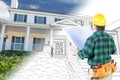 Male Contractor with Hard Hat and Tool Belt Looks At Custom Home Royalty Free Stock Photo