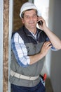 male contractor laughing while on telephone Royalty Free Stock Photo