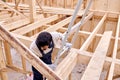 male contractor in work uniform go down the ladder after finished work Royalty Free Stock Photo