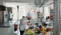 Male cook doing taste test with delicious sauce on stove Royalty Free Stock Photo