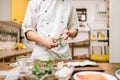 Male cook hands closeup, making sushi rolls Royalty Free Stock Photo