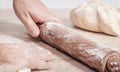 male cook rolls out dough with rolling pin Royalty Free Stock Photo