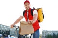 Male courier on bicycle delivering food