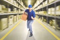 Courier running in warehouse Royalty Free Stock Photo