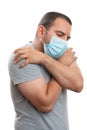 Male covering face having chills as high fever covid19 symptom