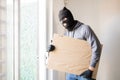 Male criminal stealing some art Royalty Free Stock Photo