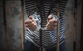 Male criminals was arrested and handcuffed in a dirty cage Royalty Free Stock Photo