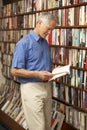 Male customer in bookshop Royalty Free Stock Photo