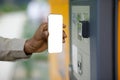 A male customer uses an automated mail terminal or self-service locker. Mail delivery concept