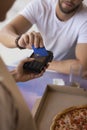 Male customer using credit card in cafe, paying for meal Royalty Free Stock Photo