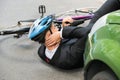 Male cyclist after car accident Royalty Free Stock Photo