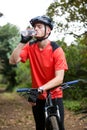 Male cyclist drinking water