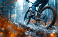 Male cyclist rides mountain bike in the forest on leaves and water splashes Royalty Free Stock Photo