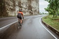 male cyclist riding his bike in country side shoot from the back Royalty Free Stock Photo