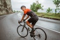 male cyclist riding his bike in country side shoot from the back Royalty Free Stock Photo