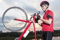 Male Cyclist Standing With Bicycle Outdoors Against Sunset. Royalty Free Stock Photo