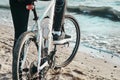 male cyclist standing on the shore . concept of ecotourism.