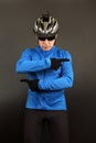 Male cyclist in top form indicates his hands in different directions