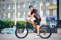 Male cyclist training on bike after hard working day Royalty Free Stock Photo