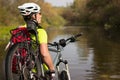 Male cyclist traveling with bike.