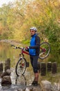 Male cyclist traveling with bike.