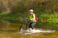 Male cyclist traveling with bike.