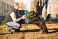 Male cynologist, police dog training outdoor