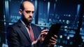 Male database admin checking hosting server on tablet