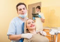 Male dentist doctor and happy patient Royalty Free Stock Photo