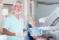 Male dentist with female patient