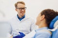 Male dentist having conversation with patient Royalty Free Stock Photo