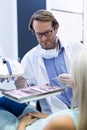 Male dentist holding tools Royalty Free Stock Photo