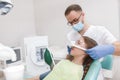 Lovely young girl at dental checkup at the clinic Royalty Free Stock Photo